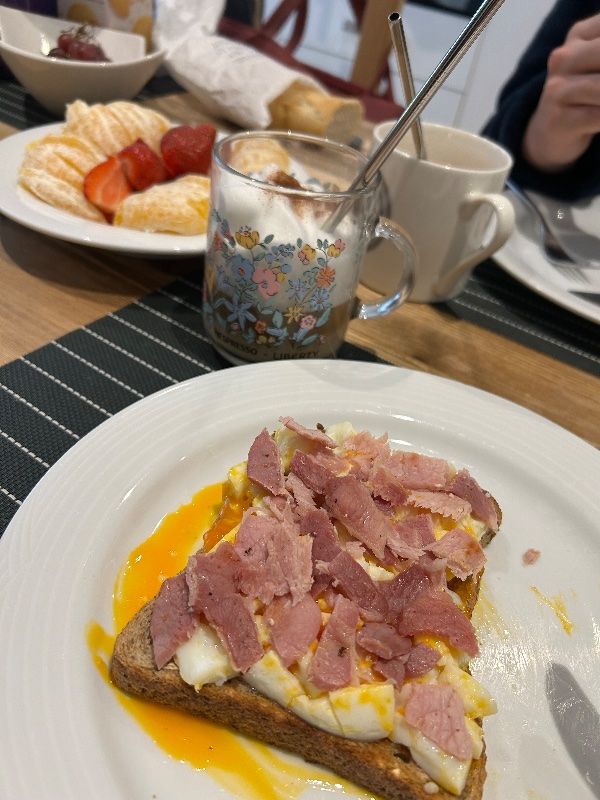 Breakfast Toast with Eggs, Bacon, and Fruit